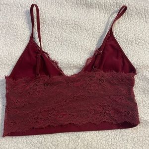 size small. adjustable straps. red lace tank.